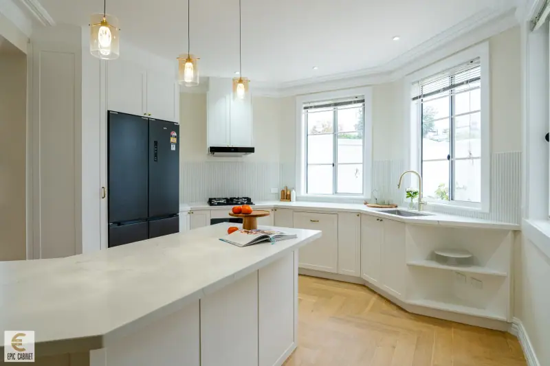 Brunswick classic white kitchen with stone island and glass pendants