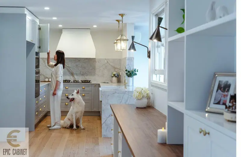 Forest Hill Hamptons kitchen blue-grey cabinetry with marble stone benchtop and brass hardware