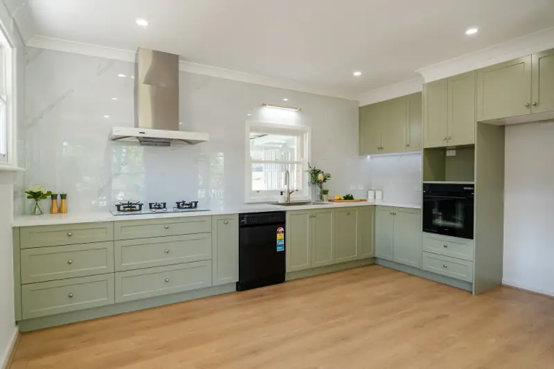 Heathmont sage green shaker kitchen with white stone benchtop